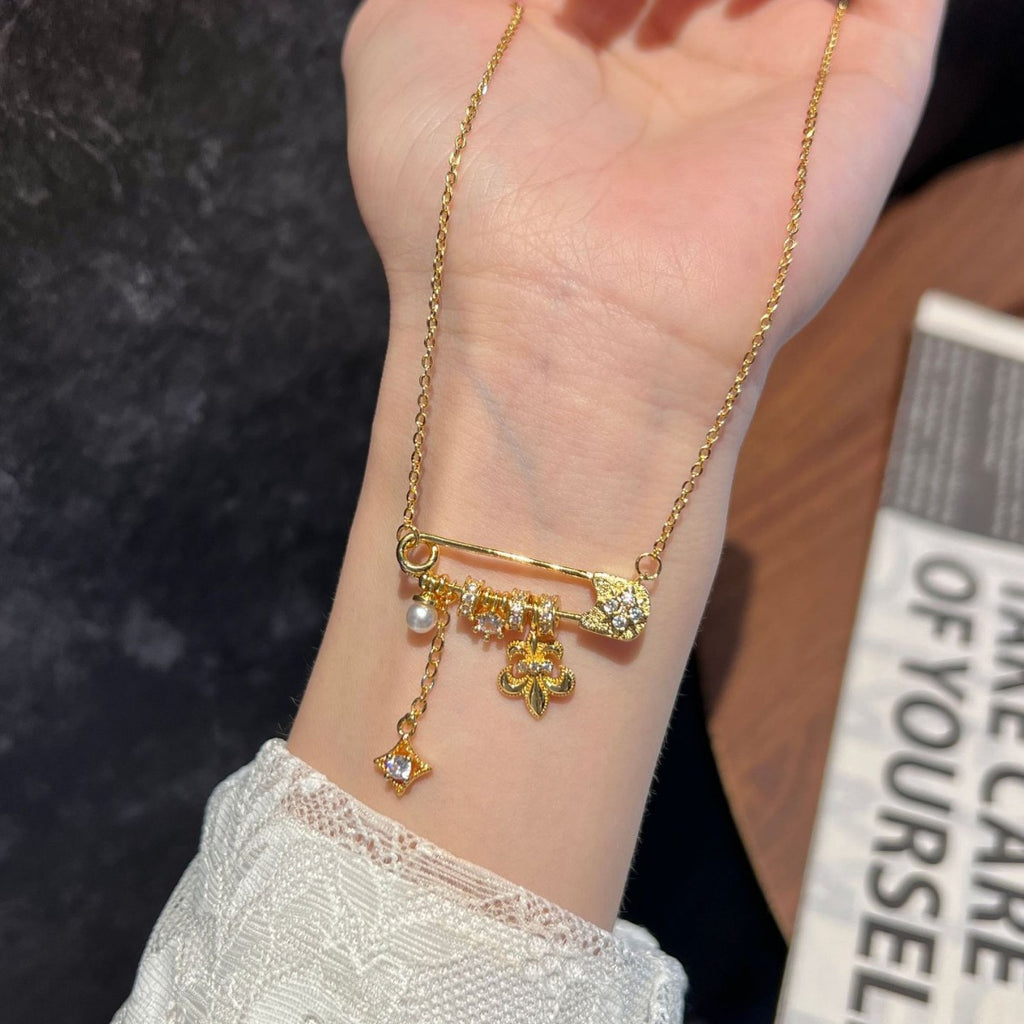 Brushed Gold Fleur-de-lis Safety Pin Pendant Necklace – Pearl & Starburst Charm Dainty Clavicle Chain for Women