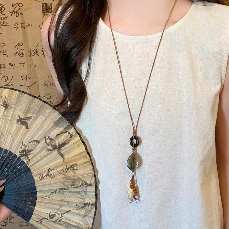 Ethnic Boho Amber Resin Heart Pendant Long Cord Necklace – Hand-Beaded Vintage Sweater Chain for Women